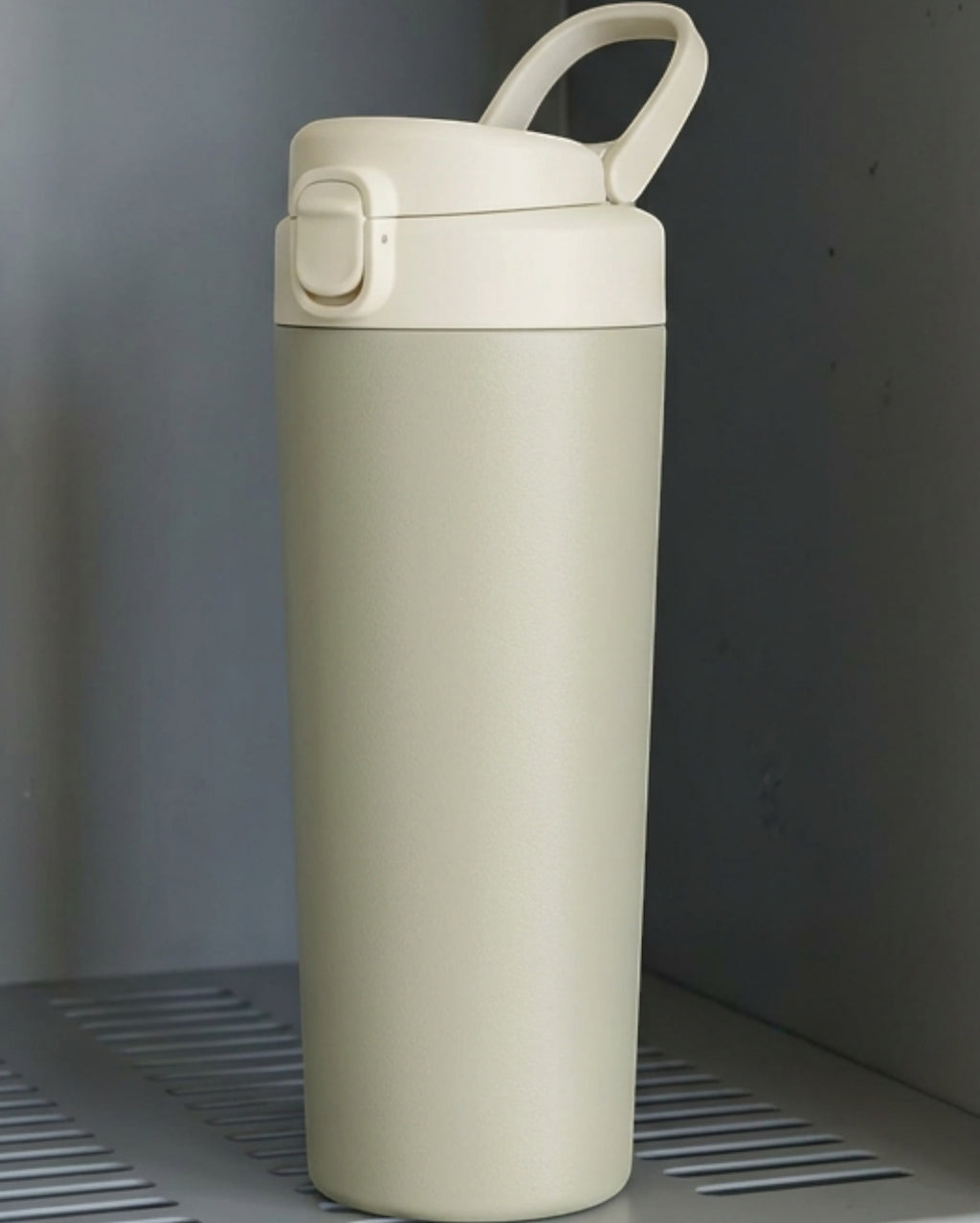 Mokfi Protected-Straw Flip-Lid Double-Wall Travel Tumbler 20 oz Sage Cream - Lifestyle view